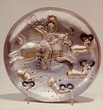 A plate with depiction of a king hunting stags or ibex