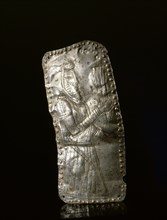 Silver repousse plaque depicting a male figure