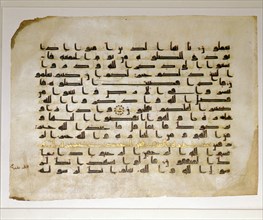 A leaf from a Koran written in Kufic script