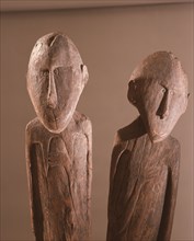 A carving depicting paired male and female clan ancestors, from a Lake Sentani mens meeting house