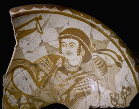 Pottery fragment with depiction of a young courtier filling a glass with wine