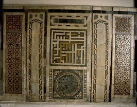 Mosaic panel with an inscription in the central square written in the interlocking script known as puzzle Kufic