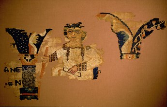 Textile fragment with man holding a scroll