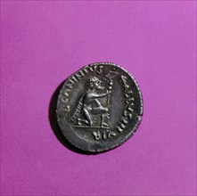 Coin of Augustus depicting a kneeling German surrendering a standard
