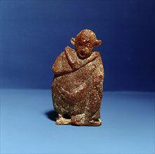 An amber statuette of an actor