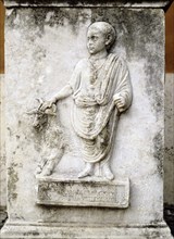 Funerary relief of a child with a goat