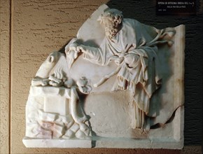 Fragment of a relief showing a Silenus offering a sacrifice at a blazing altar