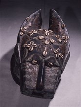 A Baule Mblo mask of a buffalo used in an entertainment masquerade called gbagba, where it is hunted by costumed young men