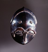 Miniature Baule mask, probably carried as a prestige object by a carver or the owner of a full sized mask