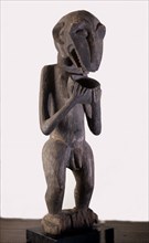 Baule monkey figure used by a spirit trance diviner to represent some form of bush spirit and as a focus for sacrifices