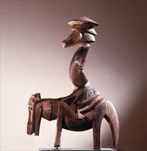Among the Senufo equestrian figures usually represent a spirit which serves as a guide and messenger to female diviners, who are called sandogo
