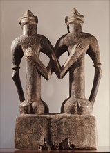 An unusual single carving depicting a primordial couple, founders of a Senufo lineage