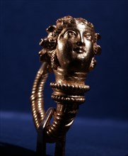 Hellenistic gold double headed earring depicting the head of a maenad