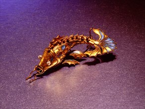 Silver gilt fish mounted on a hairpin