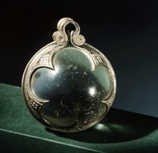 Silver mounted rock crystal sphere, a pendant from a necklace