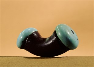 Argillite nose plug fitted with turquoise ends