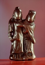 Pendant in the form of embracing lovers, or of lady supporting her inebriated partner