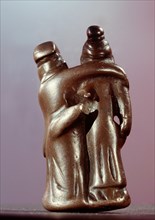 Pendant in the form of embracing lovers, or of lady supporting her inebriated partner