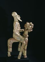 A terracotta horse mounted figure excavated from a tumulus in the Djenne/Mopti area