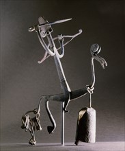 An altar iron in the form of a stylized horse and rider carrying a bow and arrow