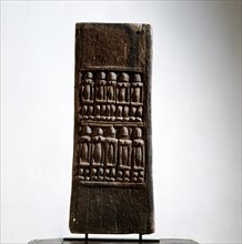 A shutter like door from a Dogon granary sculpted with rows of figures which may refer to the founding ancestors of the ownersfamily or village