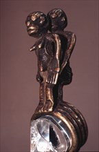 A finger ring in the form of a man and woman embracing