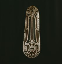 Ceremonial dance shield with a human figure outlined in inlaid sections of nautilus shell