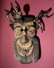 Mask of a horned, bearded devil, worn during dances to pacify evil spirits