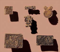 When attending festivals, the Aztecs wore face paint and probably used small pottery stamps such as these to imprint patterns on their cheeks