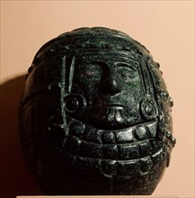 Green stone carving of a deity