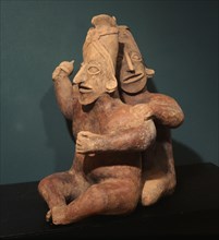 Two seated figures