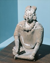 Figurine of a dignitary writing