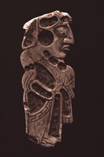 Polished stone relief carving of a Mayan dignitary