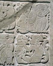 Lintel with glyphs carved in relief to represent a single date