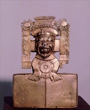 Pectoral in the form of a the fire god, Xiuhtecuhtli represented as a bearded figure with an elaborate headdress