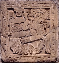 Relief from Tajin showing the rain god, Tlaloc, riding on the Earth Monster