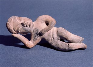 Figure of a woman lying down