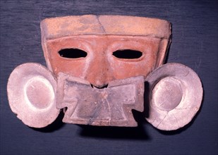 Mask showing the facial adornment worn by the nobility   a nose pendant and ear spools