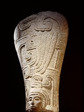 Stone carving ( palmate ) representing a head with elaborate headdress
