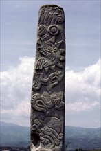 Stele carved with symbols of a sacrificial heart and Earth Monster