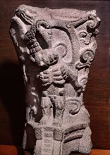 Hacha decorated in relief with a skeleton
