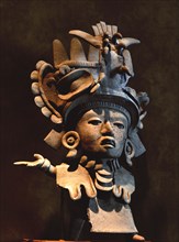 Pottery figurine with elaborate ceremonial headdress