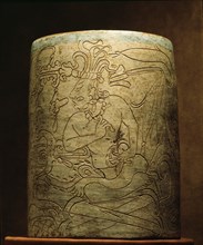 Cylindrical vessel with incised design showing seated Mayan dignitary