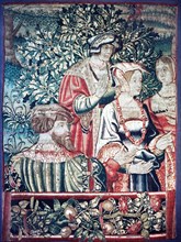 Fragment of a larger tapestry depicting a group of men and women with an oak tree