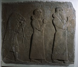 Assyrian officials with a mummer