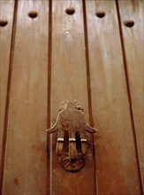 The hand of Fatima, as the doorknocker for a house in the old city of Fez