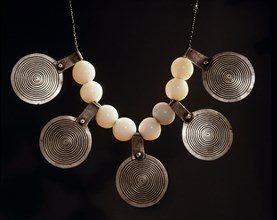Necklace with beads and circular silver pendants