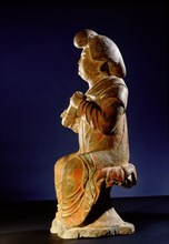 Tomb figure of a seated female musician