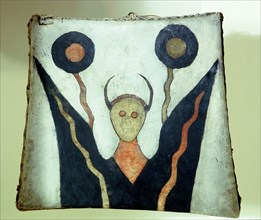 An Assiniboine hand drum painted with a spirit design reminiscent of hallucinatory images, in this case almost certainly the consequence of weakness and partial delirium resulting from fasting and thi...