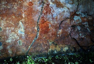 Aboriginal rock painting of a group impish like figures